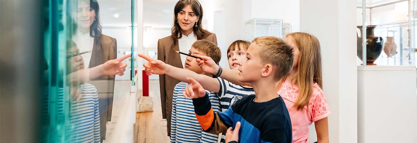 Children looking at an exhibit in a museum.